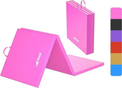 A soft pink yoga mat rolled out on a grassy field, perfect for outdoor yoga sessions.